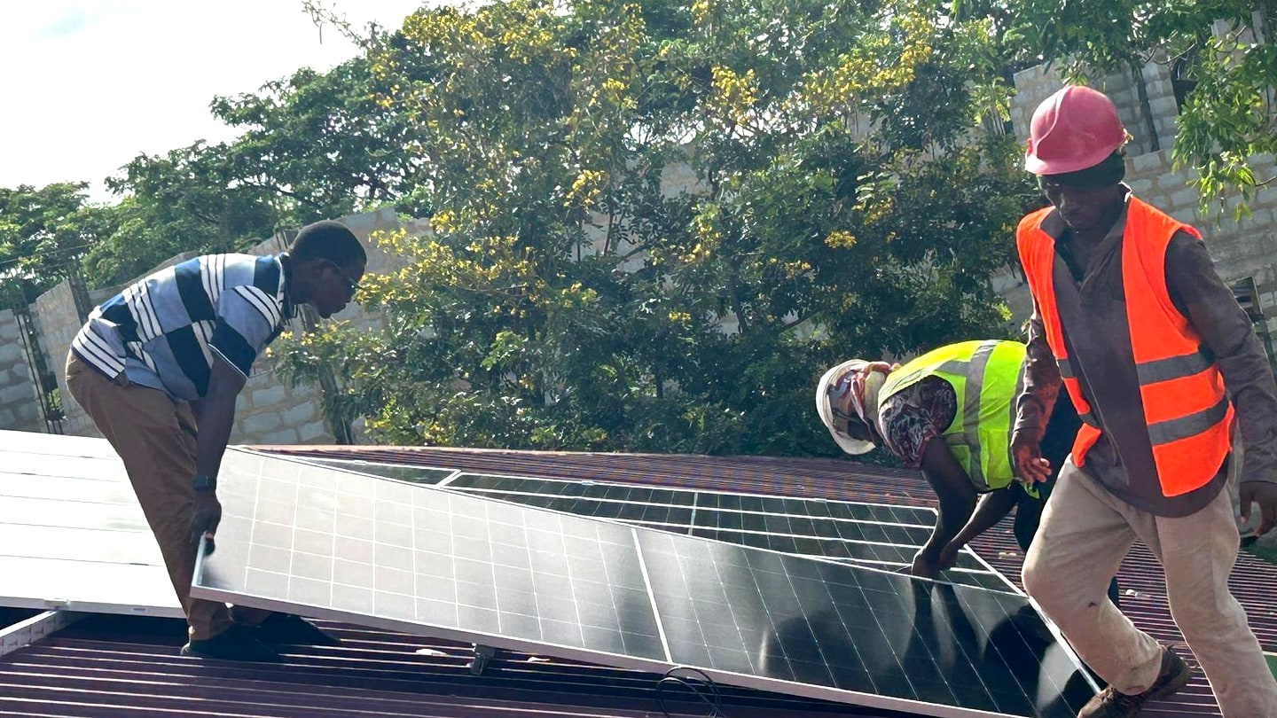 TEYETECH team installing solar panels on site